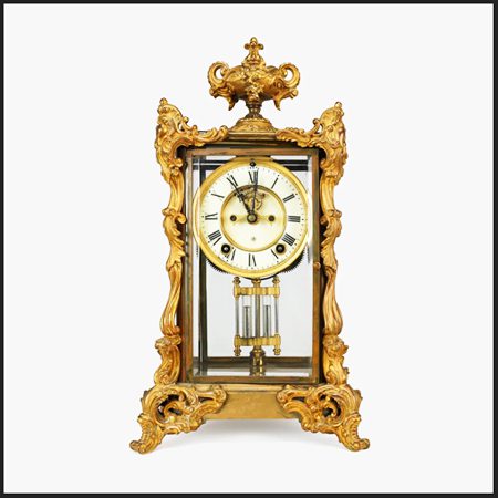 An American mantel clock, the Marquis. It is a Crystal Regulator.